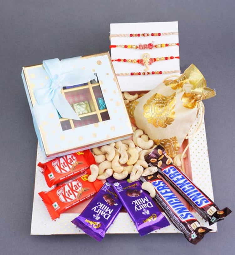 Four Rakhis Gift Hamper with Assorted Chocolates and Dry Fruits